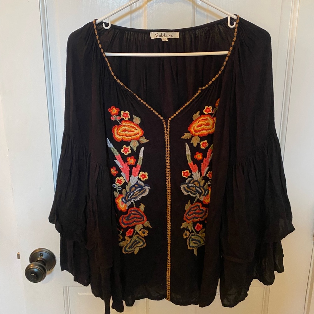 Long sleeve flowy blouse with flower detailing